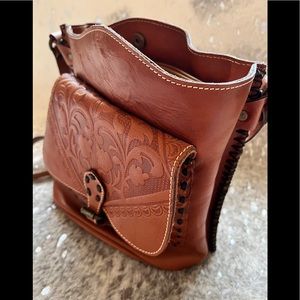 Brown leather handbag with suede interior.